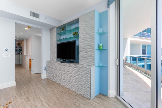 1600 S Ocean Blvd Unit Mph02, Lauderdale By The Sea, FL 33062 - unfurnished living room with wood finished floors, healthy amount of natural light, and built in shelves