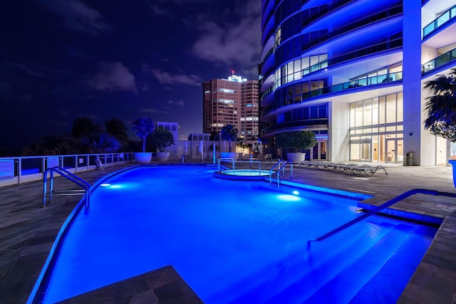 1600 S Ocean Blvd Unit Mph02, Lauderdale By The Sea, FL 33062 - pool at night featuring a hot tub and a community pool