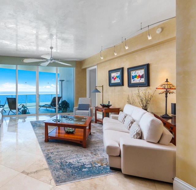 1600 S Ocean Blvd Unit Mph02, Lauderdale By The Sea, FL 33062 - living area featuring a ceiling fan, a water view, and expansive windows