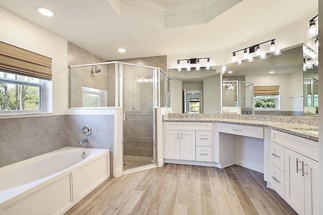 17854 N 71st Ln N, The Acreage, FL 33470 - bathroom featuring a shower stall, wood finished floors, plenty of natural light, crown molding, and recessed lighting