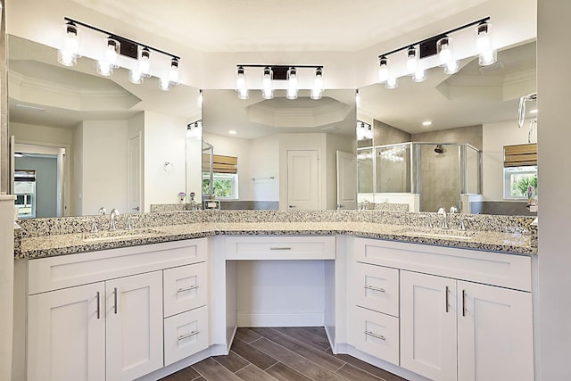 17854 N 71st Ln N, The Acreage, FL 33470 - full bath featuring crown molding, a stall shower, healthy amount of natural light, vanity, and wood tiled floors