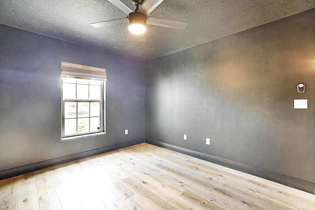 17854 N 71st Ln N, The Acreage, FL 33470 - spare room featuring wood-type flooring, ceiling fan, a textured ceiling, and baseboards