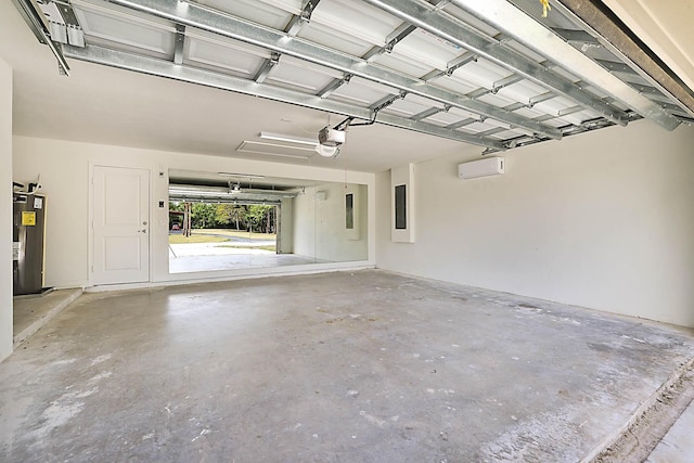 17854 N 71st Ln N, The Acreage, FL 33470 - garage with electric water heater, a garage door opener, a wall unit AC, and electric panel