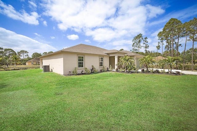 17854 N 71st Ln N, The Acreage, FL 33470 - view of front of property featuring stucco siding, a garage, a front lawn, and cooling unit