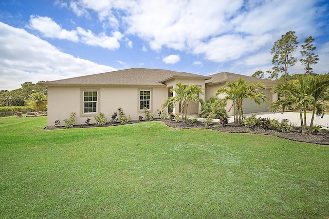 17854 N 71st Ln N, The Acreage, FL 33470 - view of front of home with an attached garage, a front yard, stucco siding, and concrete driveway