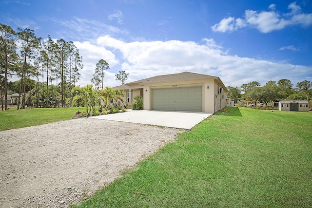17854 N 71st Ln N, The Acreage, FL 33470 - view of front of home featuring driveway, stucco siding, a front yard, and an attached garage