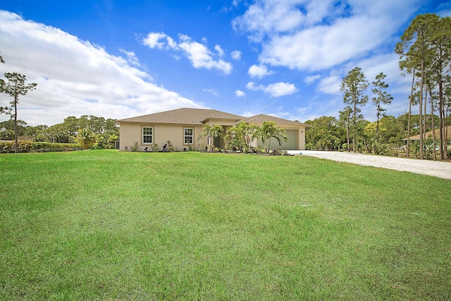 17854 N 71st Ln N, The Acreage, FL 33470 - single story home with stucco siding, a front lawn, driveway, and an attached garage