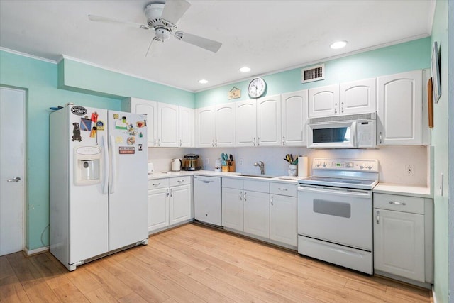 265 NE 13th St, Delray Beach, FL 33444 - kitchen with white appliances, a sink, ornamental molding, ceiling fan, and light countertops