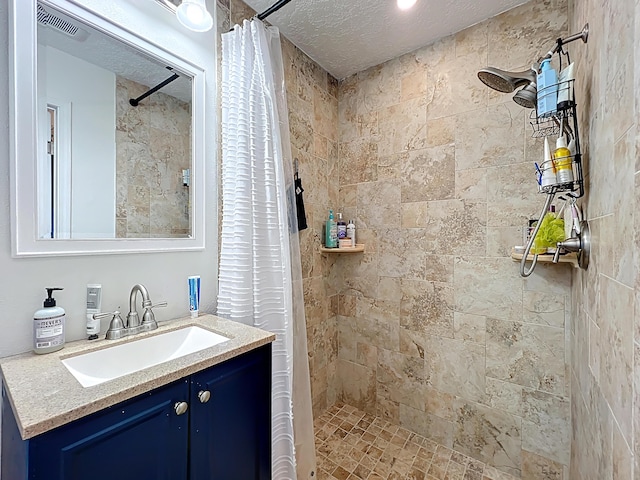 178 Via De La Reina, Merritt Island, FL 32953 - full bathroom with visible vents, tiled shower, and vanity