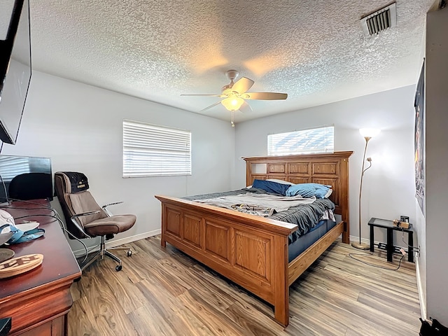 178 Via De La Reina, Merritt Island, FL 32953 - bedroom featuring visible vents, light wood-type flooring, a ceiling fan, and baseboards
