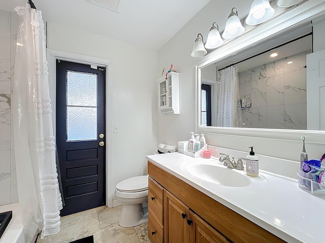 178 Via De La Reina, Merritt Island, FL 32953 - bathroom featuring visible vents, toilet, and vanity