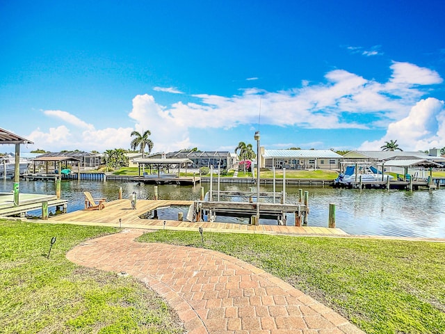 178 Via De La Reina, Merritt Island, FL 32953 - dock area with a lawn, a water view, a residential view, and boat lift