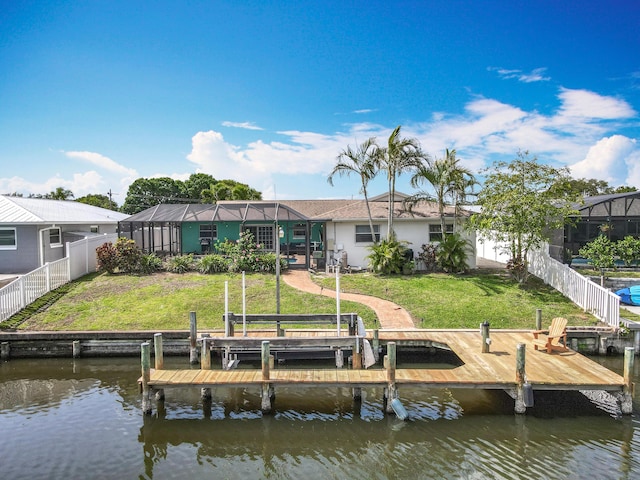 178 Via De La Reina, Merritt Island, FL 32953 - dock area featuring a yard, a water view, boat lift, and a fenced backyard