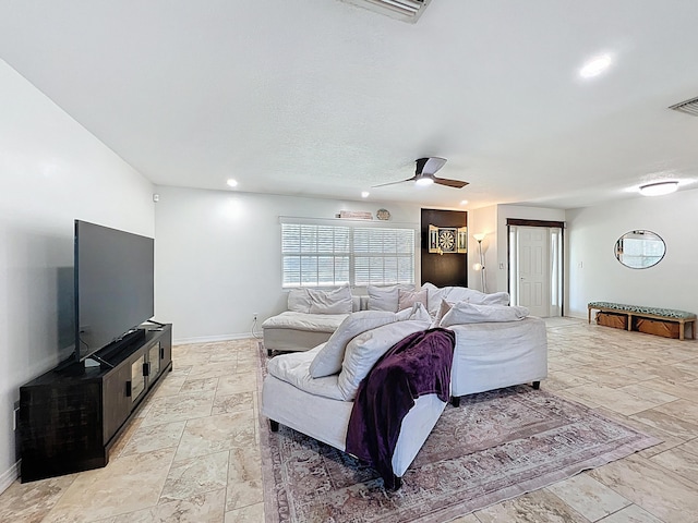 178 Via De La Reina, Merritt Island, FL 32953 - living room featuring recessed lighting, ceiling fan, visible vents, stone finish floor, and baseboards