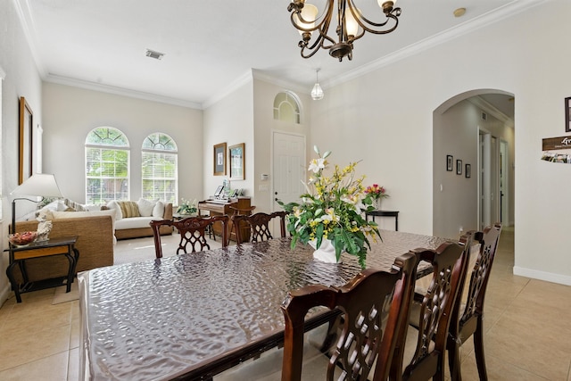 707 Cresta Cir, West Palm Beach, FL 33413 - dining area with visible vents, crown molding, arched walkways, a notable chandelier, and light tile patterned flooring