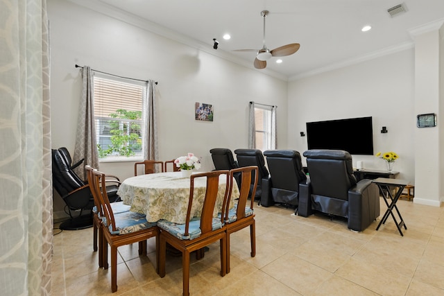 707 Cresta Cir, West Palm Beach, FL 33413 - dining area with a ceiling fan, light tile patterned floors, ornamental molding, and a healthy amount of sunlight