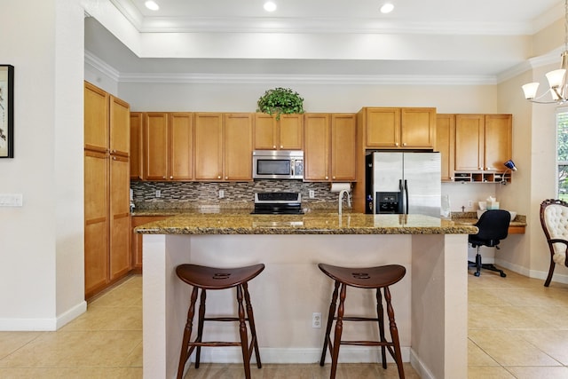 707 Cresta Cir, West Palm Beach, FL 33413 - kitchen with a kitchen breakfast bar, light tile patterned floors, and stainless steel appliances