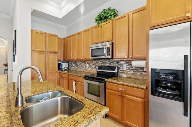 707 Cresta Cir, West Palm Beach, FL 33413 - kitchen with decorative backsplash, ornamental molding, light stone counters, a sink, and stainless steel appliances