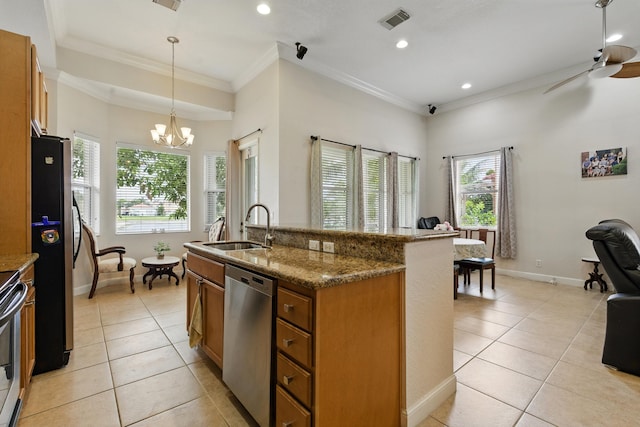 707 Cresta Cir, West Palm Beach, FL 33413 - kitchen with a sink, brown cabinetry, stainless steel appliances, light tile patterned floors, and visible vents