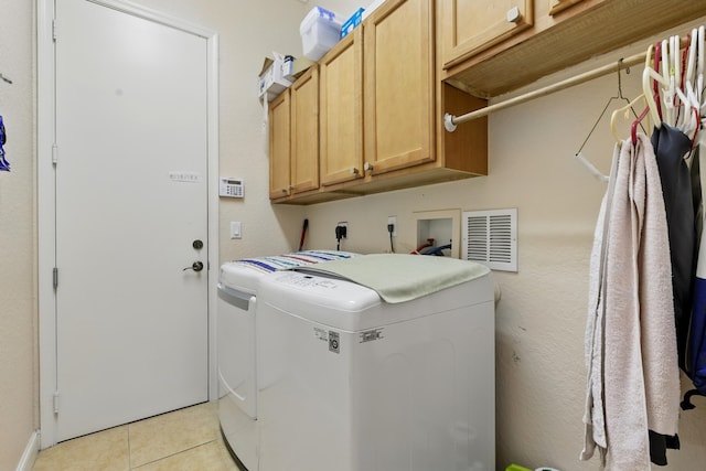 707 Cresta Cir, West Palm Beach, FL 33413 - laundry area with cabinet space, separate washer and dryer, visible vents, and light tile patterned floors
