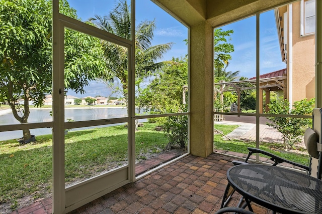 707 Cresta Cir, West Palm Beach, FL 33413 - sunroom / solarium with a water view