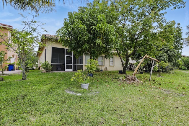 707 Cresta Cir, West Palm Beach, FL 33413 - view of yard with a sunroom