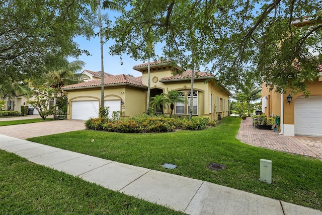 707 Cresta Cir, West Palm Beach, FL 33413 - mediterranean / spanish house with a garage, stucco siding, decorative driveway, and a front lawn