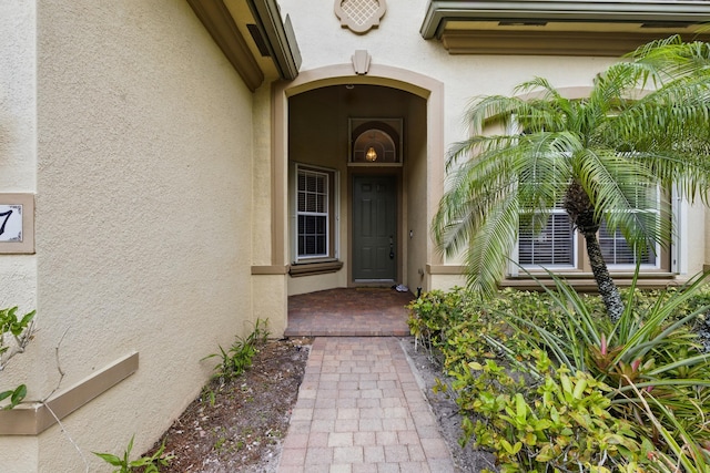 707 Cresta Cir, West Palm Beach, FL 33413 - view of exterior entry featuring stucco siding