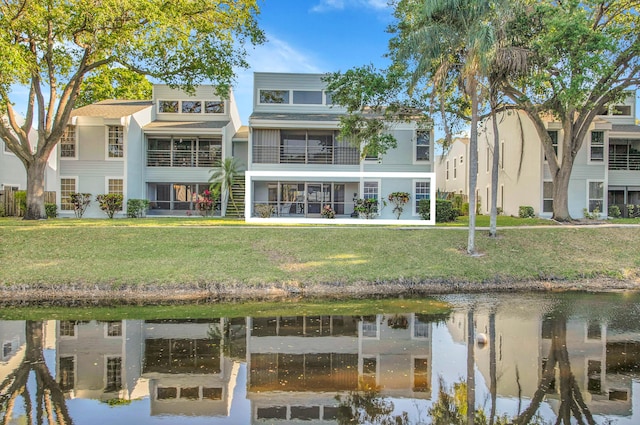 6117 Old Court Rd Unit 135, Boca Raton, FL 33433 - back of property featuring a yard and a water view