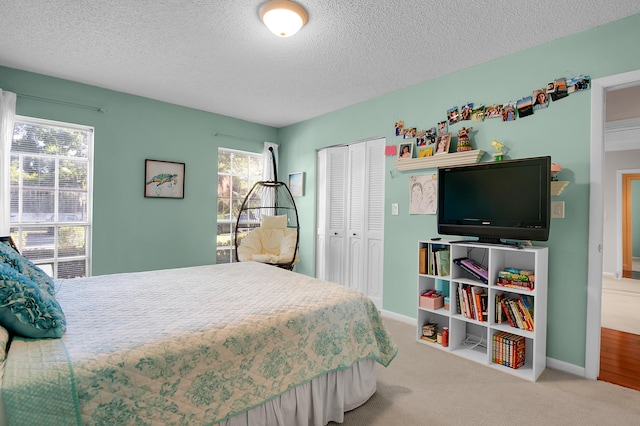 6117 Old Court Rd Unit 135, Boca Raton, FL 33433 - bedroom with carpet, baseboards, a textured ceiling, and a closet