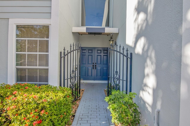 6117 Old Court Rd Unit 135, Boca Raton, FL 33433 - doorway to property with a gate and stucco siding