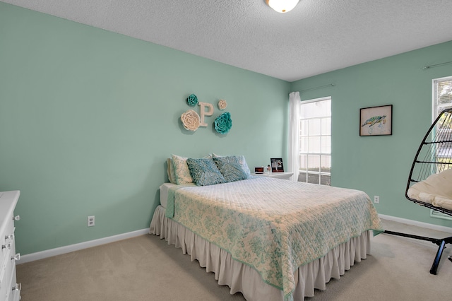 6117 Old Court Rd Unit 135, Boca Raton, FL 33433 - bedroom featuring multiple windows, baseboards, and light carpet
