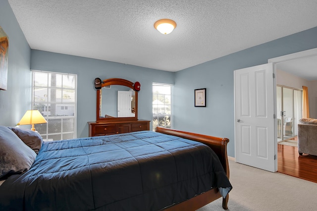 6117 Old Court Rd Unit 135, Boca Raton, FL 33433 - bedroom with a textured ceiling and light carpet