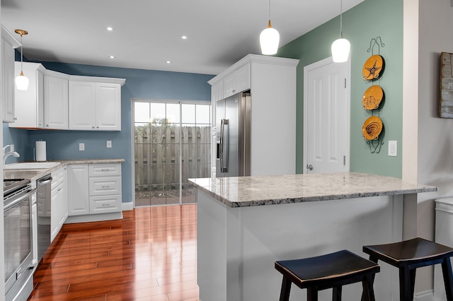 6117 Old Court Rd Unit 135, Boca Raton, FL 33433 - kitchen featuring white cabinets, dark wood finished floors, stainless steel appliances, a sink, and light stone countertops