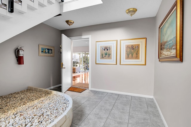 6117 Old Court Rd Unit 135, Boca Raton, FL 33433 - bedroom with baseboards and light tile patterned flooring