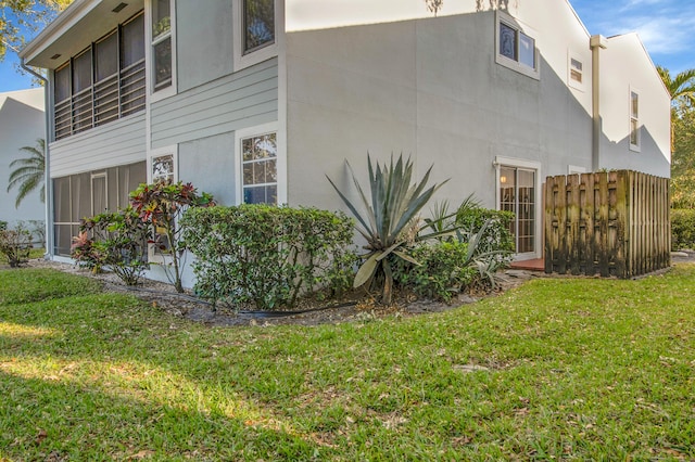 6117 Old Court Rd Unit 135, Boca Raton, FL 33433 - view of side of home with a lawn and stucco siding
