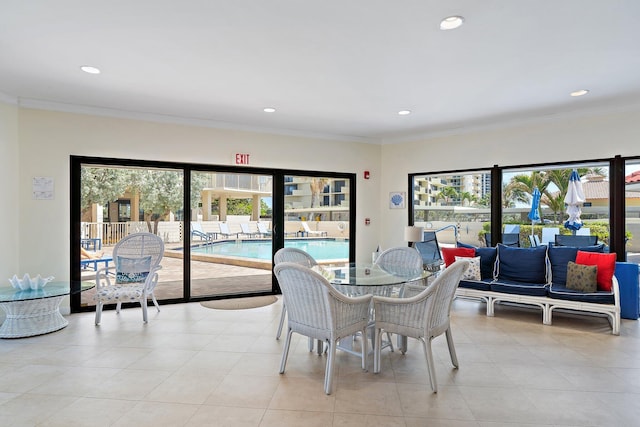 dining area with light tile patterned floors, crown molding, and recessed lighting