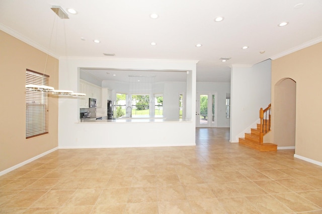 unfurnished living room featuring recessed lighting, crown molding, and a healthy amount of sunlight