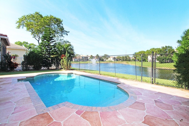 view of swimming pool featuring fence, a fenced in pool, and a water view