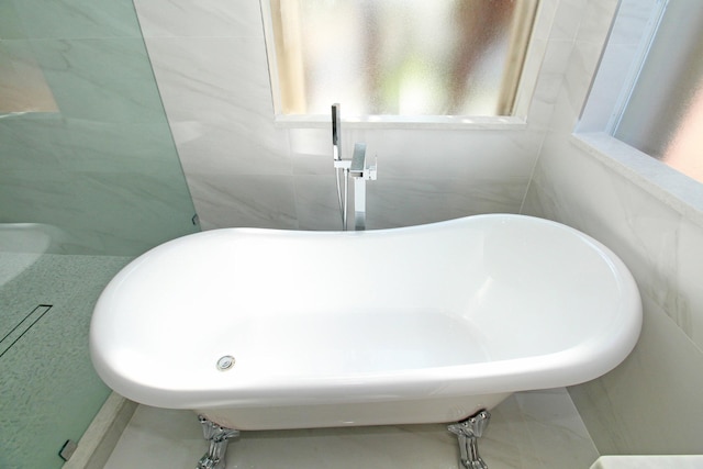 bathroom with a soaking tub