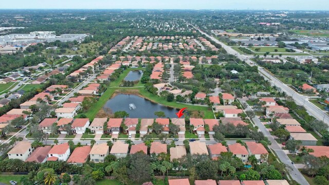 birds eye view of property with a residential view and a water view