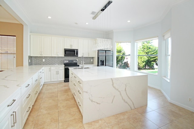 kitchen with stainless steel fridge with ice dispenser, backsplash, black range with electric stovetop, a sink, and light tile patterned flooring