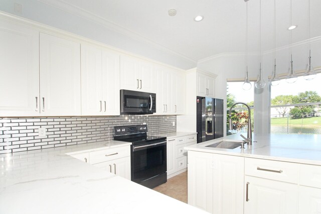 kitchen with black / electric stove, ornamental molding, a sink, decorative backsplash, and refrigerator with ice dispenser