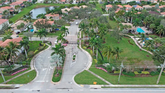 bird's eye view featuring a residential view and a water view
