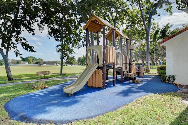 community playground featuring a yard