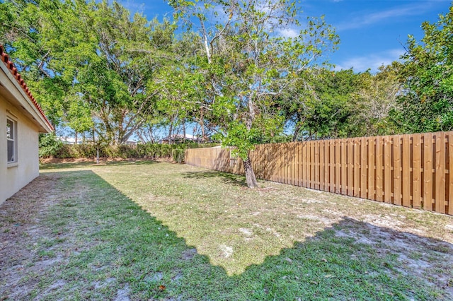 view of yard with a fenced backyard