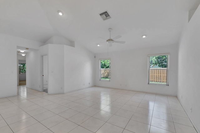 unfurnished room featuring visible vents, ceiling fan, lofted ceiling, and a healthy amount of sunlight