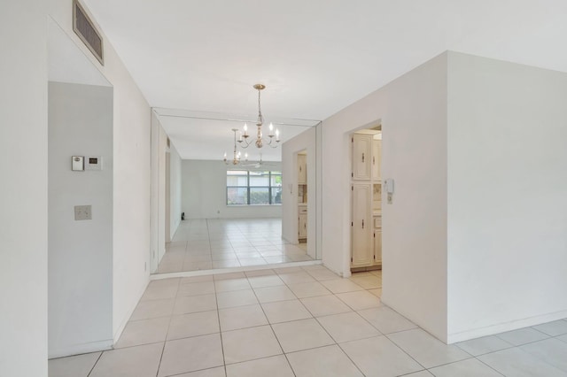 955 Circle A Dr Unit A, Delray Beach, FL 33445 - hall featuring a chandelier, light tile patterned floors, and baseboards