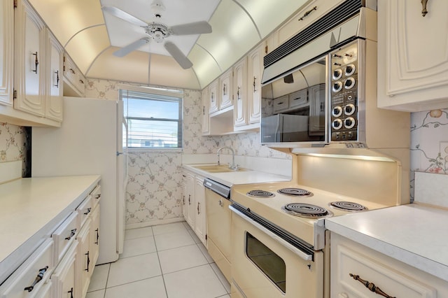 955 Circle A Dr Unit A, Delray Beach, FL 33445 - kitchen featuring white appliances, a sink, ceiling fan, light tile patterned flooring, and light countertops