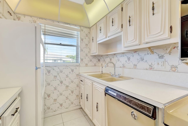 955 Circle A Dr Unit A, Delray Beach, FL 33445 - kitchen featuring white appliances, a sink, light tile patterned flooring, wallpapered walls, and baseboards